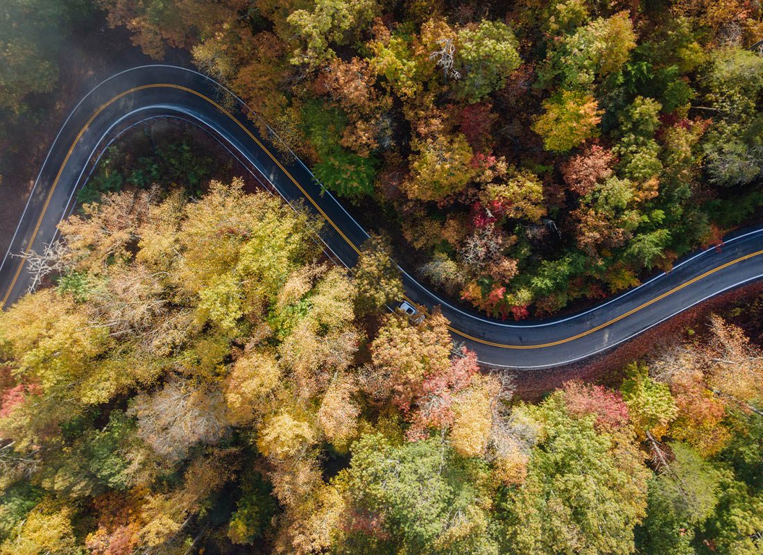 About Our Agency - Aerial View of the Tail of the Dragon Road Near the Tennessee and North Carolina Border in the Smoky Mountains in the Fall